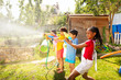 © Sergey Novikov - Kids shoot with water pistols on summer day