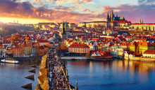 Panoramic View Above At Charles Bridge Prague Castle And River Vltava Prague Czech Republic. Picturesque Landscape With Sunset Old Town Houses With Red Tegular Roofs And Broach Tower.