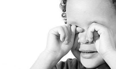 Wall Mural - boy crying poverty with no help crying alone and all by himself on white background stock photo 