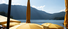 View Of Lake Over Yellow Umbrellas