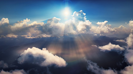 Wall Mural - flying through heavenly beautiful sunny cloudscape. amazing of golden fluffy clouds moving softly on