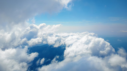Wall Mural - flying through amazingly beautiful cloudscape. picturesque of white fluffy clouds moving softly on t