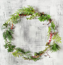 Winter Wreath On The Wooden Background