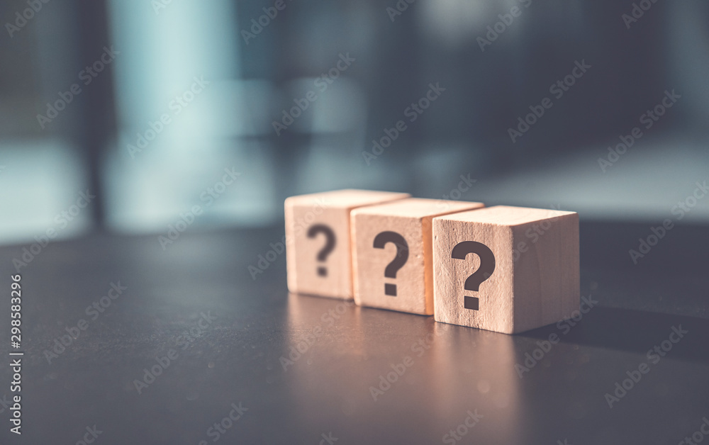 ? Questions Mark word in wooden cube block on table background. FAQ  Answer, Q&A. - obrazy, fototapety, plakaty 