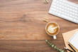 © satapatms - Wood minimalist office desk table with computer keyboard, cup of cafe latte coffee and supplies. Top view with copy space, flat lay, minimal style.