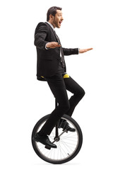 Sticker - Businessman riding a unicycle