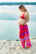 © YouraPechkin - Beautiful pregnant woman relaxing outside in the park