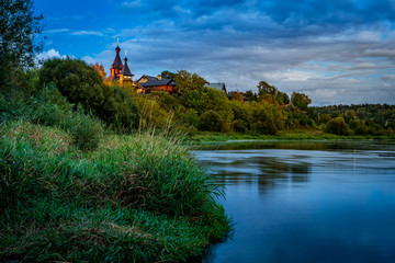 Old church on the river at blue hour after sunset