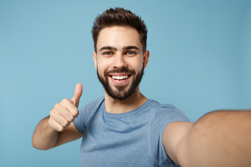 close up young handsome man in casual clothes posing isolated on blue background studio portrait. pe