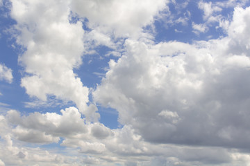 White clouds in the blue sky background,