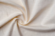 Fragment of crumpled light cotton linen fabric