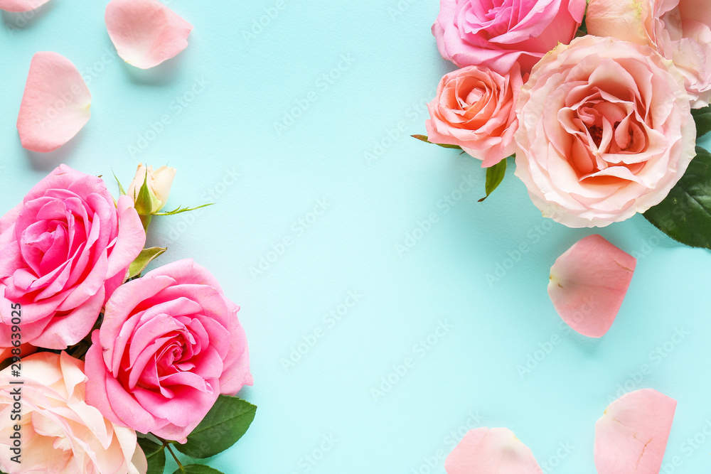 Beautiful fresh roses on color background