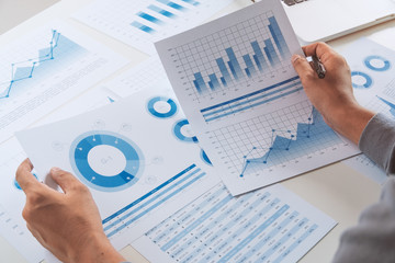 Wall Mural - businessman working data document graph chart report marketing research development  planning management strategy analysis financial accounting. Business  office concept.