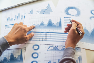 Wall Mural - businessman working data document graph chart report marketing research development planning managem