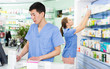 © JackF - Female and male specialist are attentively stocktaking medicines
