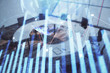 © Andrey - Double exposure of stock market graph with globe hologram on conference room background. Concept of international finance