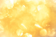 Golden Color Blurred Abstract Background. Yellow Bokeh Christmas Blurred Beautiful Shiny Christmas Lights.