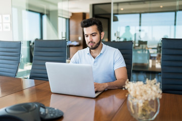 Wall Mural - Young Male Professional Using Technology At Office