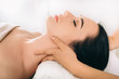 © Peakstock - Brunette Woman relaxing during spa treatment . She receive relaxation massage while spa weekend