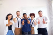 © alfa27 - Good job of business team. International group of diverse people showing thumb at camera