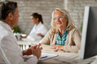 © Drazen - Smiling mature woman having a counselling with healthcare worker at clinic.