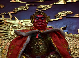 Sticker - Statue of a red god in a Chinese temple