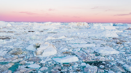 Wall Mural - global warming - greenland iceberg landscape of ilulissat icefjord with giant icebergs. icebergs fro