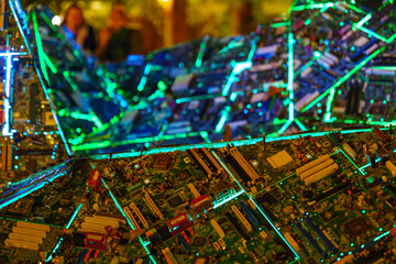 Wall Mural - Close up view at installation art with recycle computer motherboards for Essen Festival of Light in Essen, Germany during night.