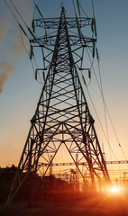 Wall Mural - Electrical substation silhouette on the dramatic sunset background