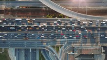 Beautiful Aerial View To The Cars Driving On Multi-level Highway In Moscow. Direct View From Above To The Road Traffic In A Big City On The Sunny Evening.