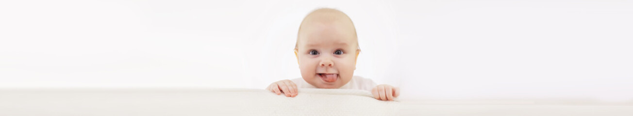 baby and emotions. little baby and place for text. long poster.