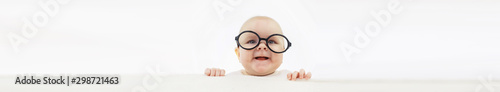 Fotografía Baby and emotions. Little baby and place for text. Long poster.