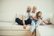 © alfa27 - Beautiful family relax at home, Portrait of beautiful caucasian family sitting on sofa. Family, children concept
