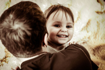 Wall Mural - dad plays with the baby in bed