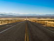 © gchapel - Straight road through the Nevada desert with a diminishing perspective landscape photograph