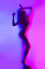 Beauty Model Girl Dancing Silhouette. Beautiful Sexy Young Woman With Perfect Slim Body Dancing In Colorful Uv Neon Lights. Seduction. Disco Go Go Dancer. Perfect Slim Body