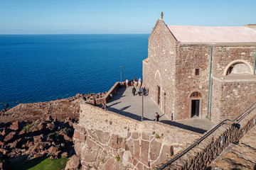 Wall Mural - CASTELSARDO, SARDINIA / OCTOBER 2019: Church by the sea