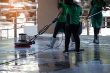 The Worker Cleaning  Floor Walkway With Using Polishing Machine And Chemical Or Acid