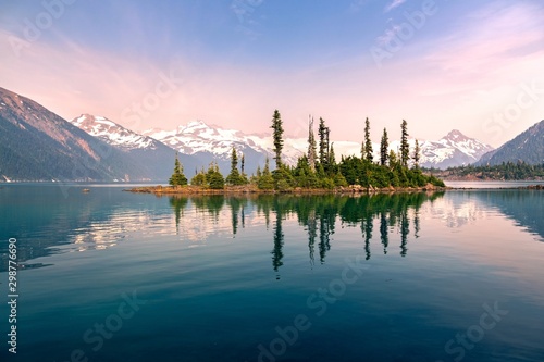 Fotografía Battleship Island with Pine Trees reflected in calm water of Garibaldi Lake Land