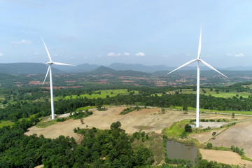 Wind turbine is alternative electrical power with blue sky, summer field, renewable energy