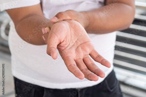 Cuadros en Lienzo old senior man suffering from trigger finger, cps or carpal tunnel syndrome, gou