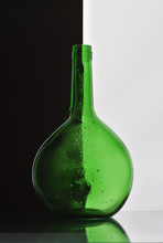 Green Bottle On Black Background