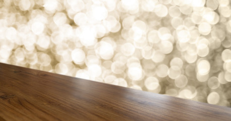 Leinwandbilder - Empty old rustic angle wood table top with blur sparkling gold bokeh abstract background,panoramic banner for display or montage of product,Holiday seasonal concept backdrop.