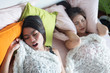 woman sleeping and snoring out loud, waking her roommate up. concept of sleeping disorder, snoring problem