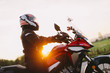 © Photocreo Bednarek - Woman riding motobike at sunset