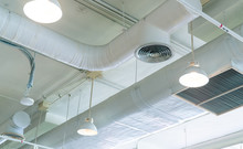 Air Duct, Air Conditioner Pipe And Fire Sprinkler System On White Ceiling Wall. Air Flow And Ventilation System. Building Interior. Ceiling Lamp Light With Opened Light. Interior Architecture Concept.