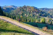 © Jurek Adamski - Woman backpacker on hiking trail in the mountains in autumn sunny day, Pieniny, Poland