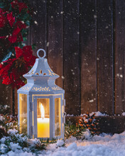 Snowy Night Scene With Glowing Lantern