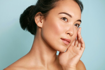 Wall Mural - skin care. woman with beauty face and healthy facial skin portrait. beautiful asian girl model with 