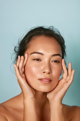 Wall Mural - skin care. woman with beauty face and healthy facial skin portrait. beautiful asian girl model with 